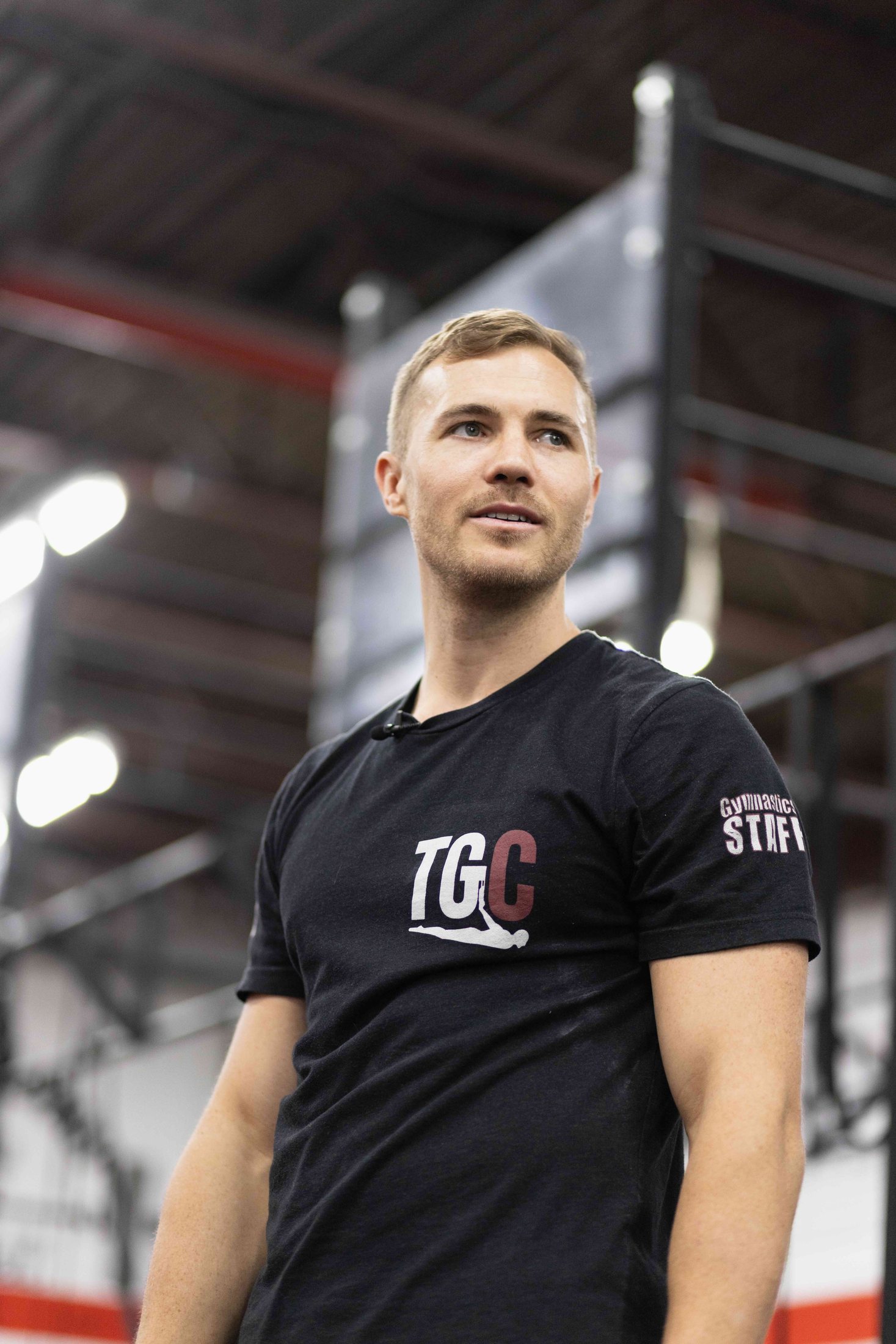 Portrait of Dane Leavy coaching at a gymnastics seminar