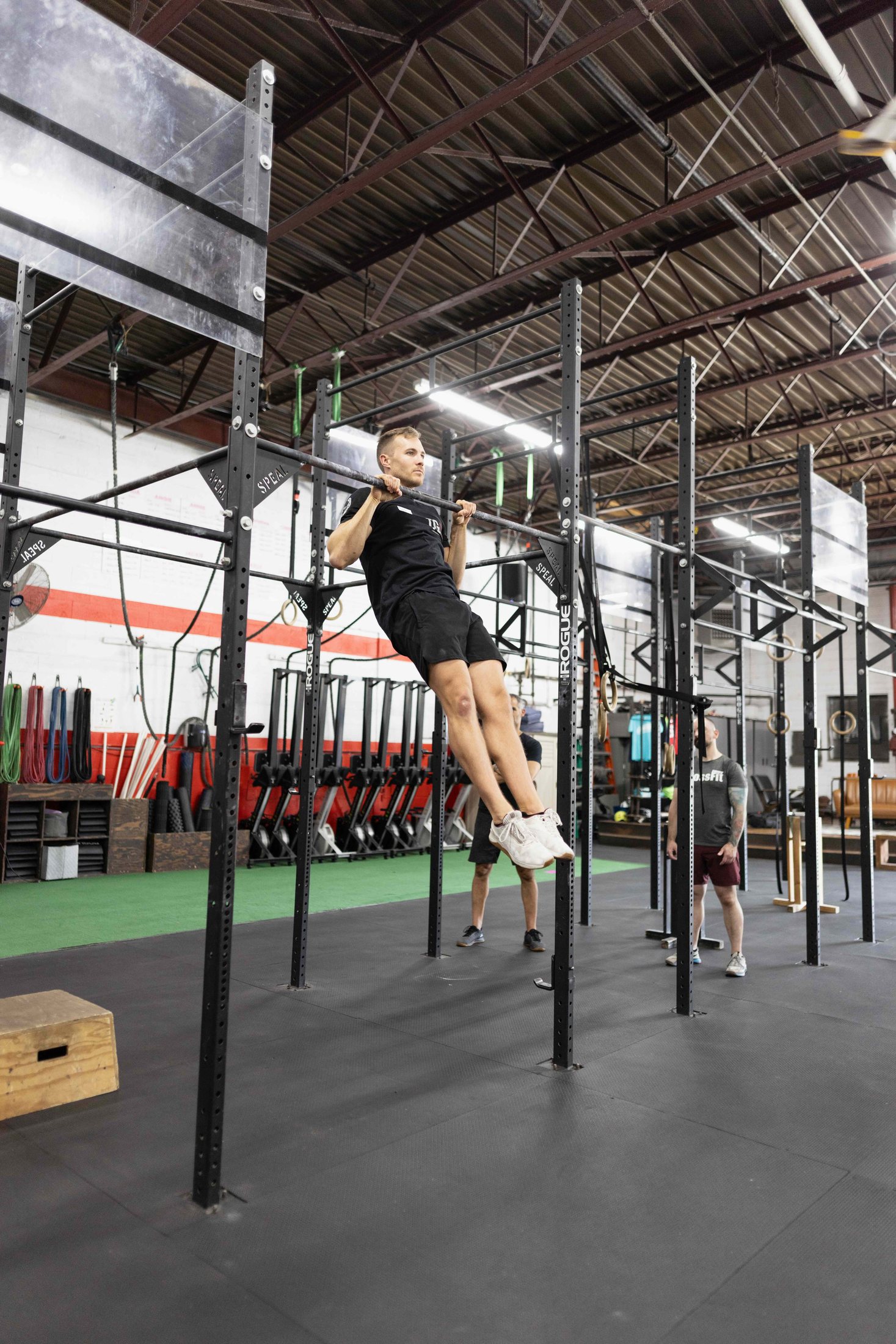 Dane demonstrating pulling strength on a bar