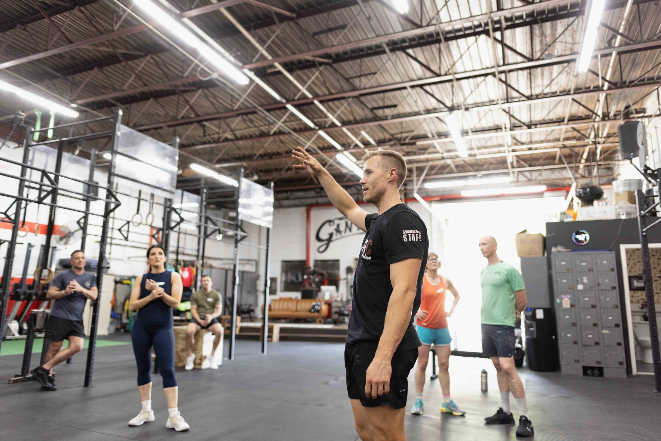 Dane coaching athletes during a shared training hour